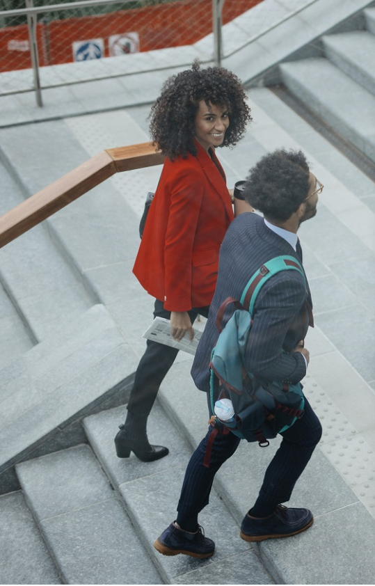 Kinto Join - two people walking up steps smiling
