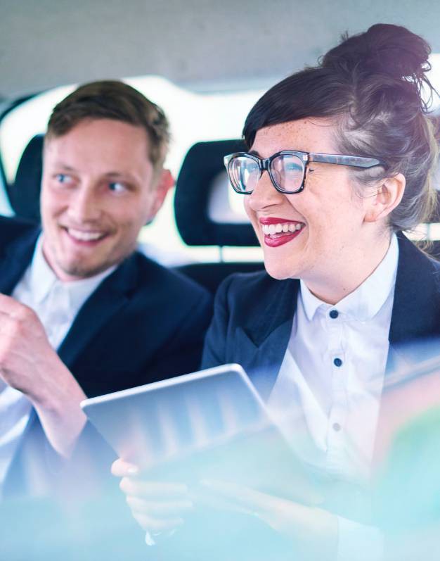 Kinto car share, 2 people happy in the back seat laughing