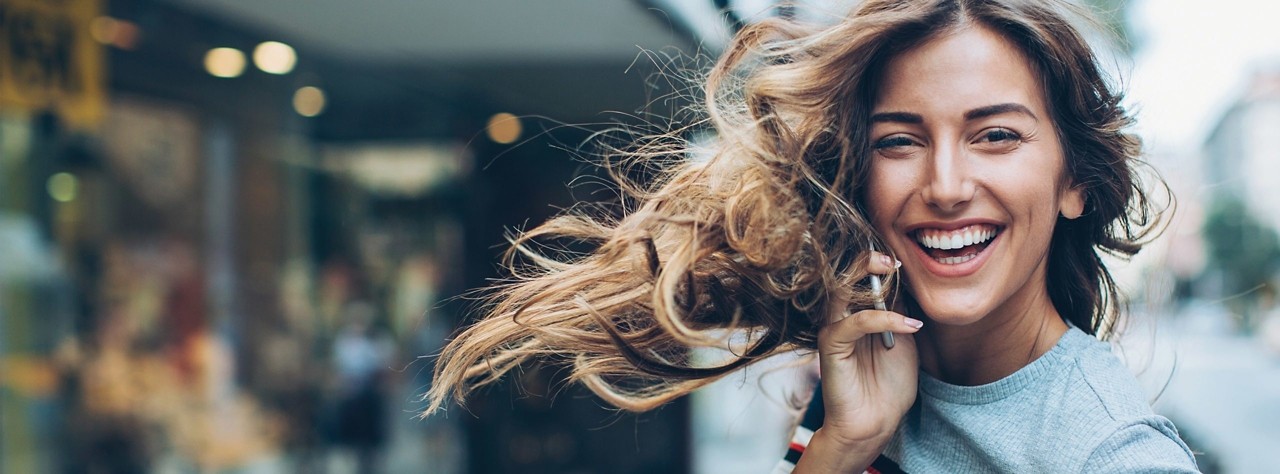 Woman on phone smiling