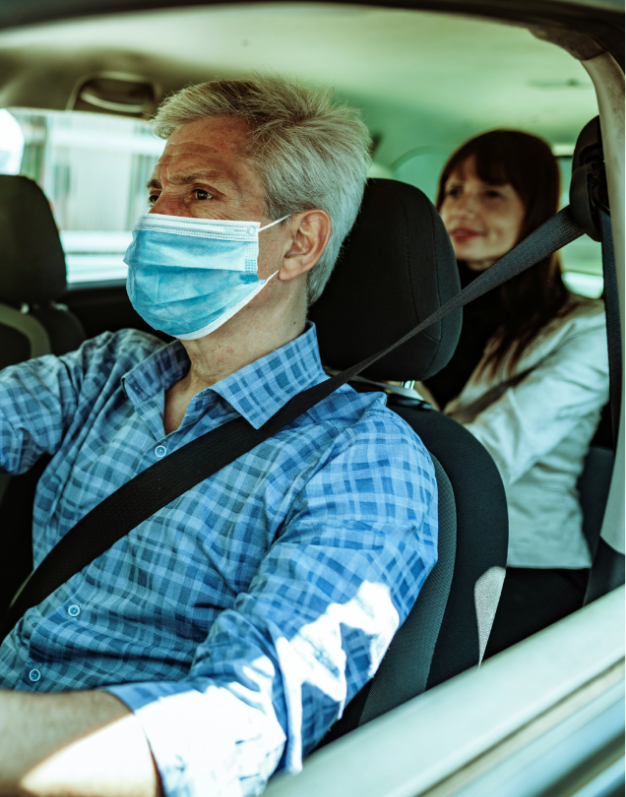 Kinto car share with a driver wearing a mask